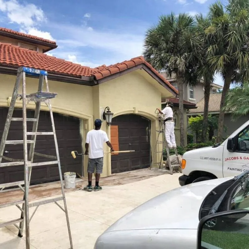 Jacobs and Gallucci painting crew working on residential exterior