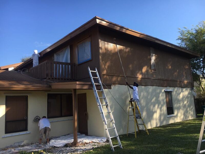 Painting crew working on multi-unit residential exterior