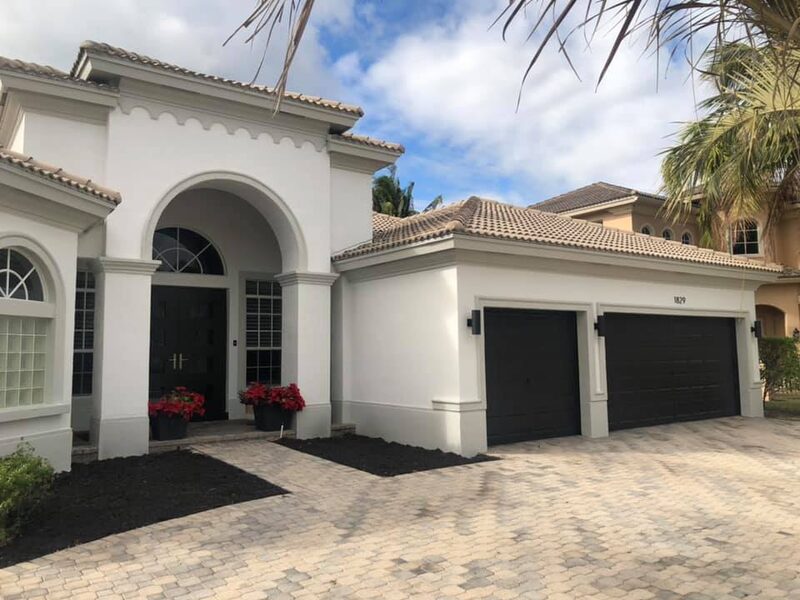 Exterior painting on white Mediterranean home in South Florida